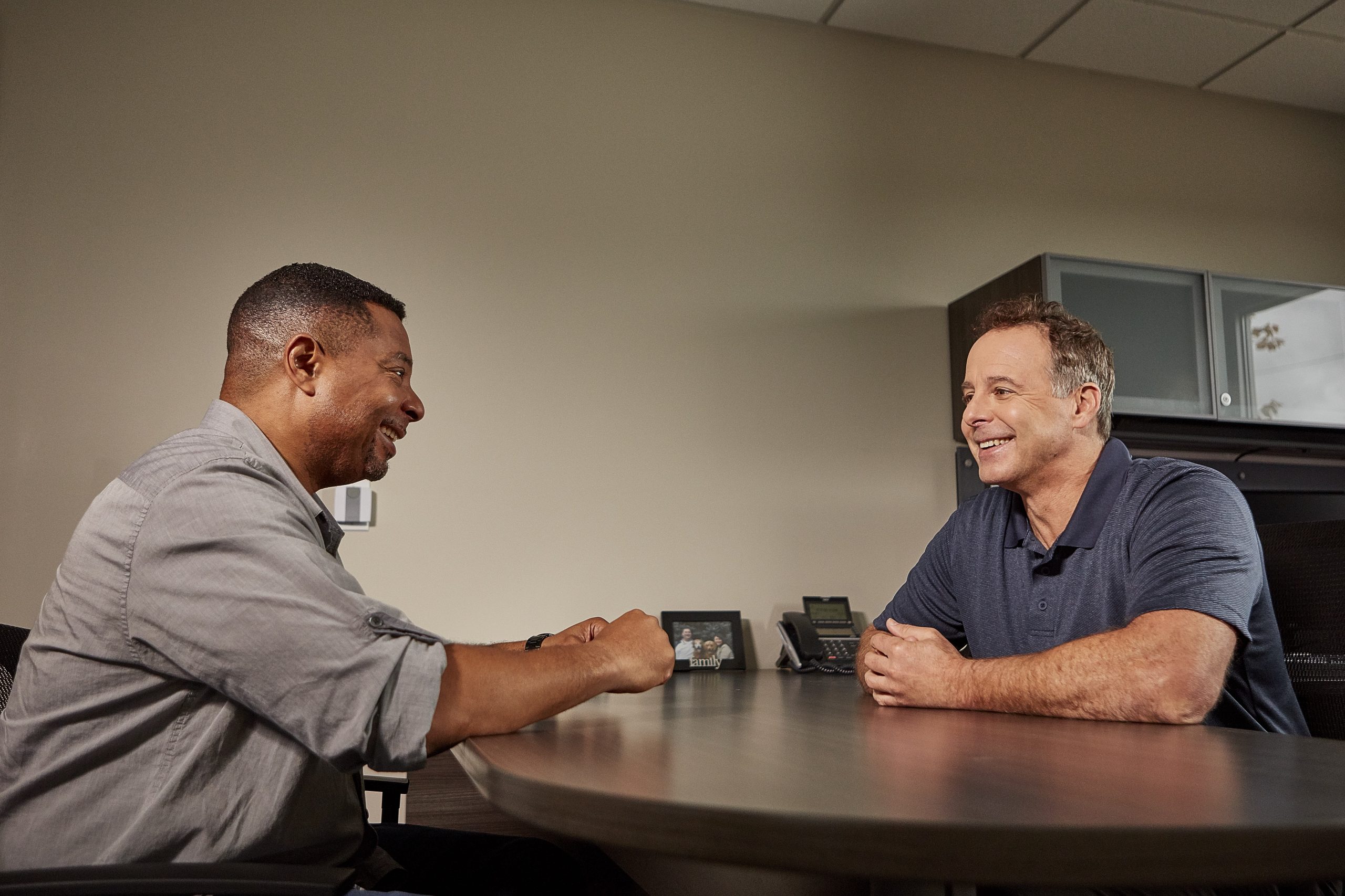 Two men discussing at a table